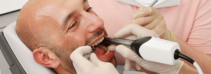 Man with intraoral camera